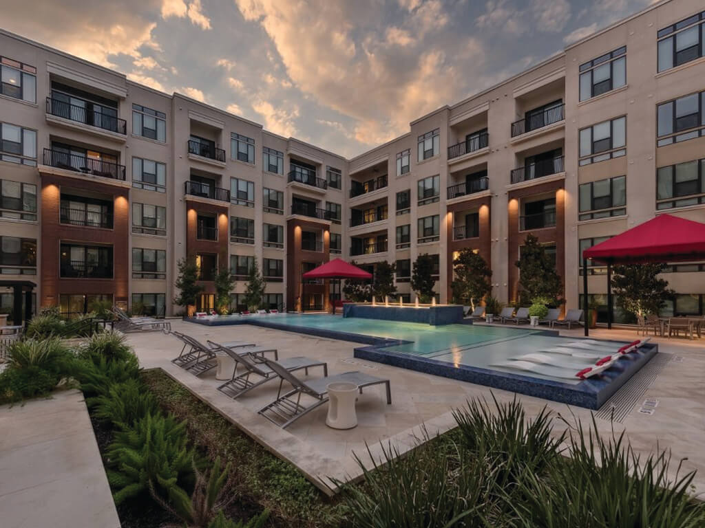 A modern kitchen with dark cabinets at the Ascent at CityCentre Apartments in Houston, Texas.